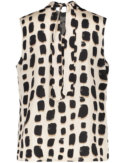 sleeveless animal print blouse