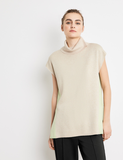 sleeveless cream jumper