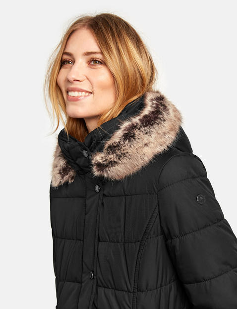 Quilted jacket with a hood and a faux fur collar