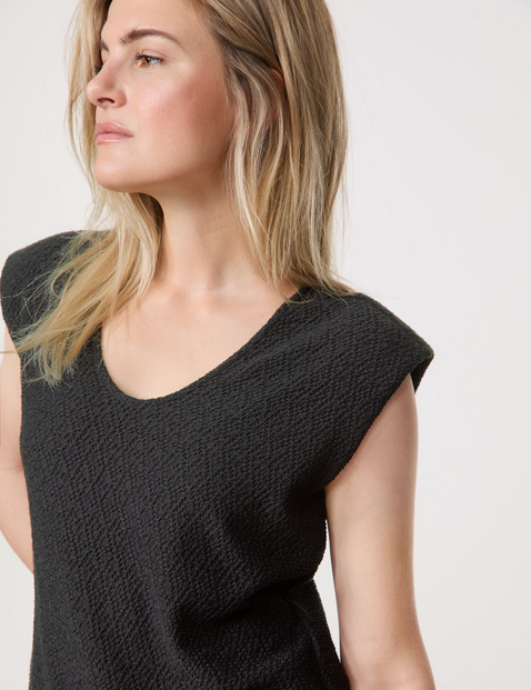 Textured top with shoulder padding