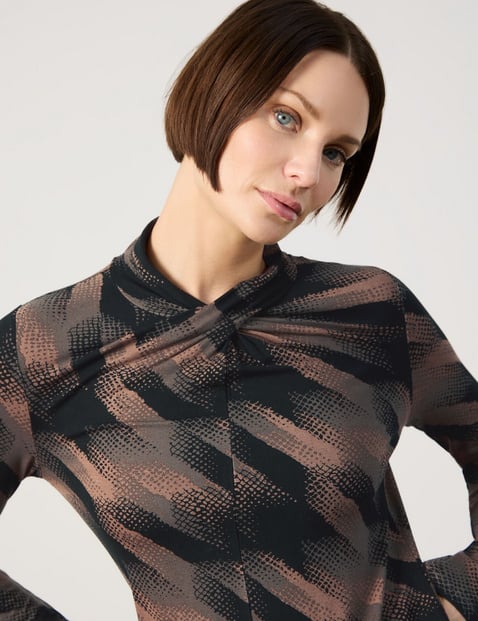 Long sleeve top with a wrap-over effect on the neckline