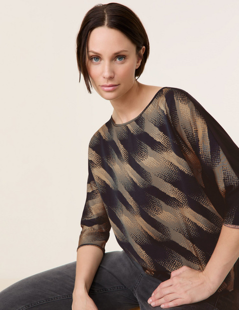 3/4-sleeve top with a flowing blouse front