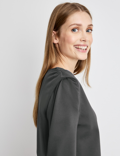 Long sleeve top with shoulder pads