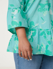 Uitlopende blouse met volants