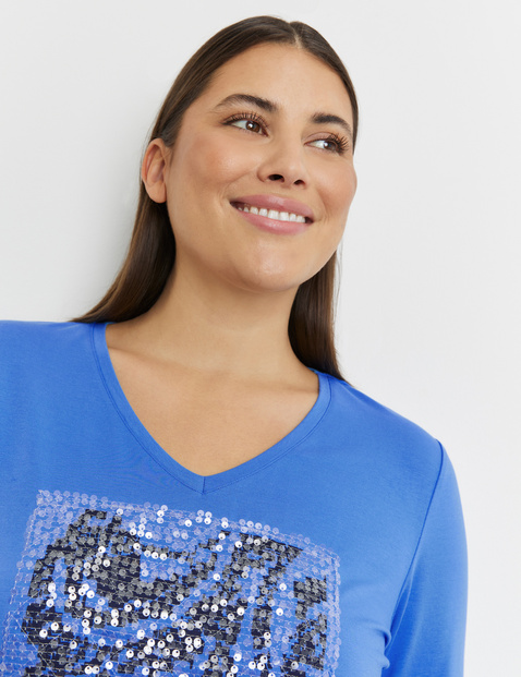 Top with 3/4-length sleeves and sequins