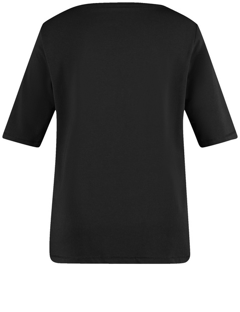 Top with mid-length sleeves and sequin embellishment