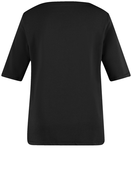 Top with mid-length sleeves and sequin embellishment