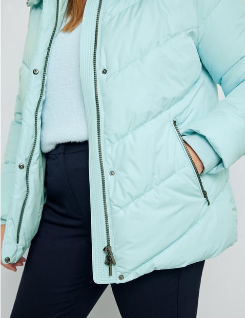 Quilted jacket with a concealed hood