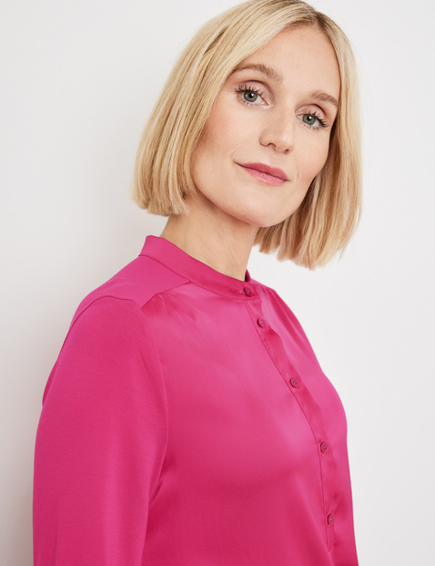 Blouse top with a button placket and stand-up collar in Pink