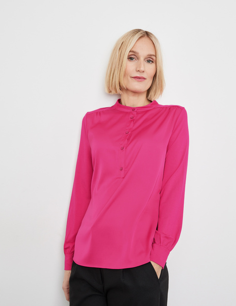 Blouse top with a button placket and stand-up collar in Pink