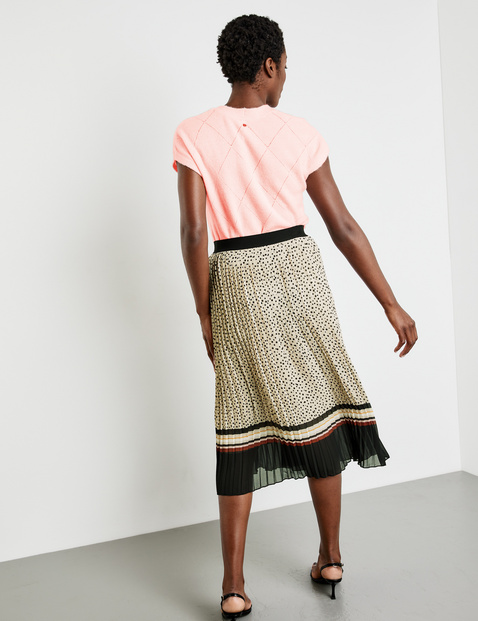 Polka dot pleated skirt with an elasticated waistband in