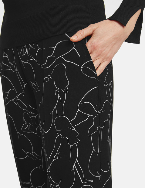 Wide trousers with an art print