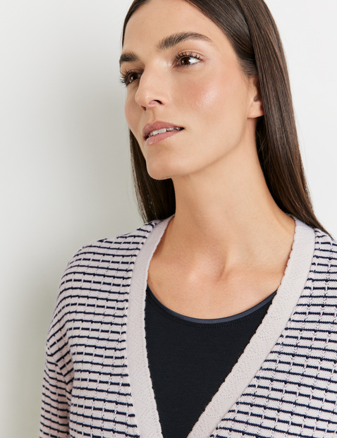 Fashionable cardigan with a decorative trim