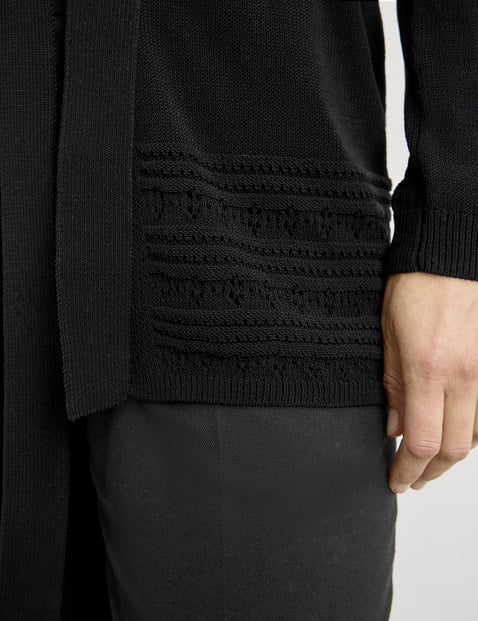 Open cardigan with crocheted details and a tie-around belt