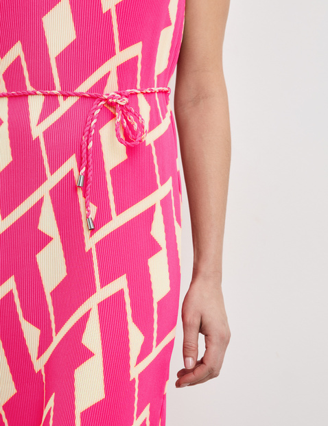 Patterned pleated dress with a waistband