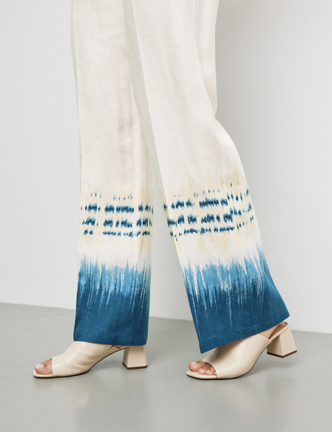 Linen trousers with a patterned hem