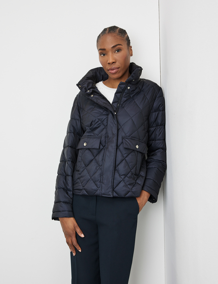 Quilted jacket with a stand-up collar and patch pockets in Blue 