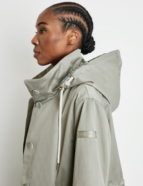 Long outdoor jacket with a drawstring waist