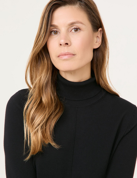 Polo neck jumper with sleeve vents