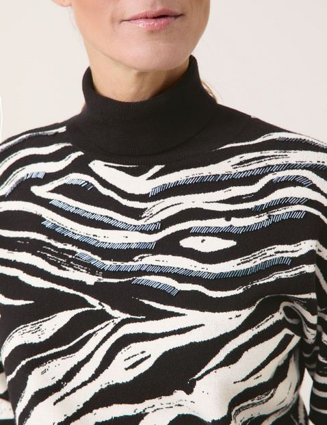 Polo neck jumper with an animal print