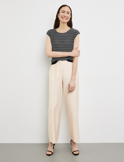 Striped sleeveless jumper in a textured knit