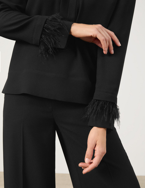 Long sleeve blouse with a feather detail