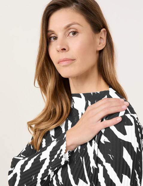 Pleated long sleeve top with a stand-up collar