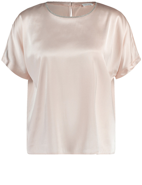 Blouse top with a glittering neckline trim