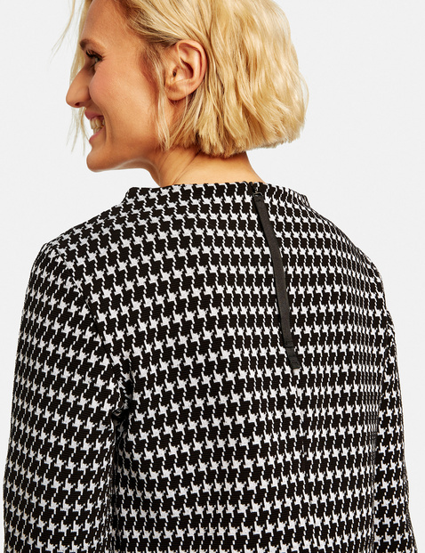 Dress with a houndstooth pattern