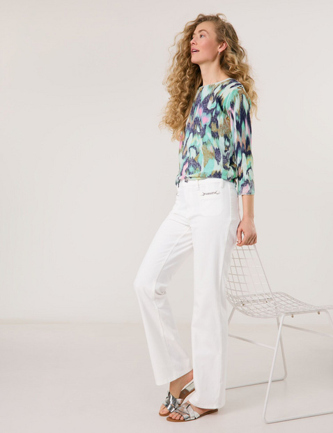 Flared Jeans mit Kettendetail