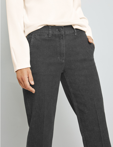 Jeans with pressed pleats