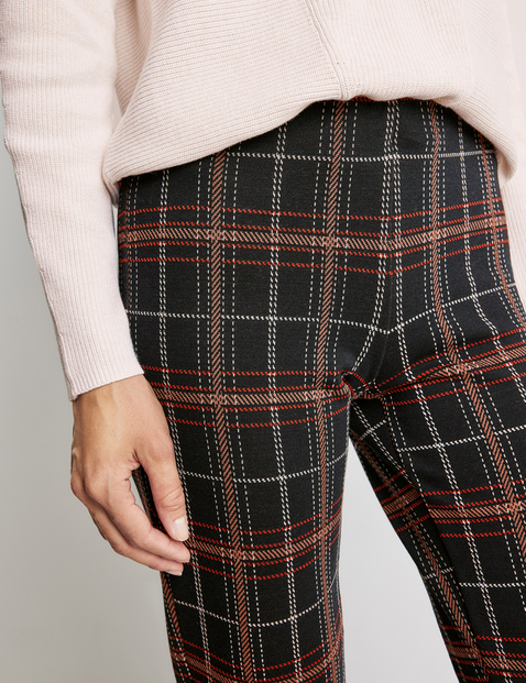 Trousers with large checks