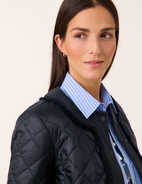 Quilted jacket with fabric panelling