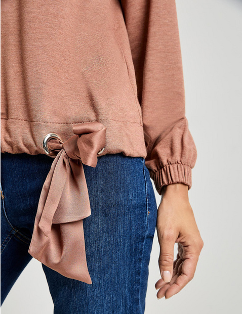 Long sleeve top with a knotted detail