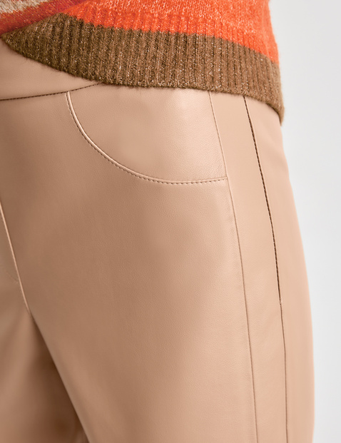 Slim-fitting trousers in faux leather