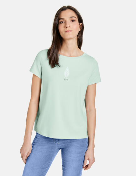 white t shirt with green print