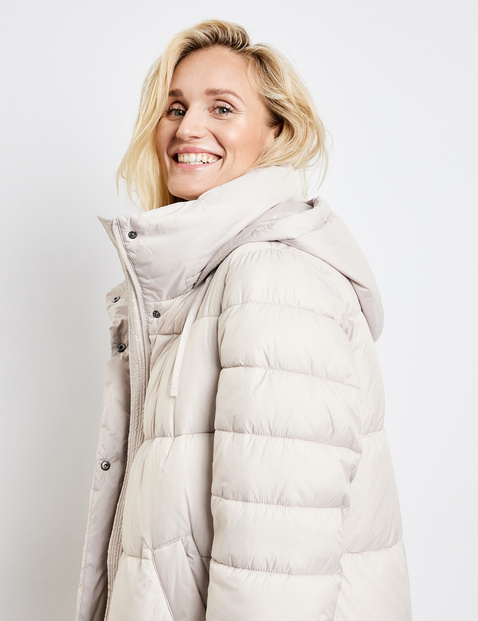 Quilted coat with a stand-up collar in Beige | GERRY WEBER
