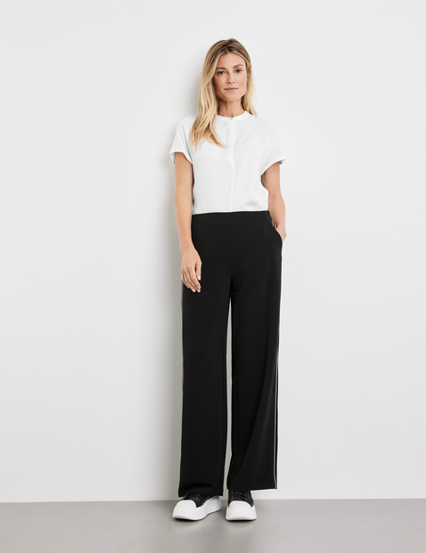 Slip-on trousers with side piping in Black