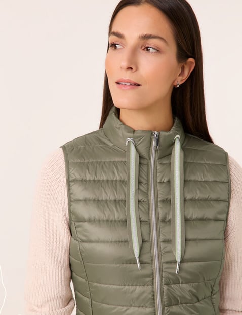 Quilted body warmer with grosgrain ribbon ties