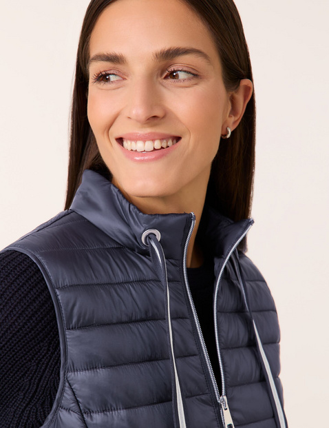 Quilted body warmer with grosgrain ribbon ties